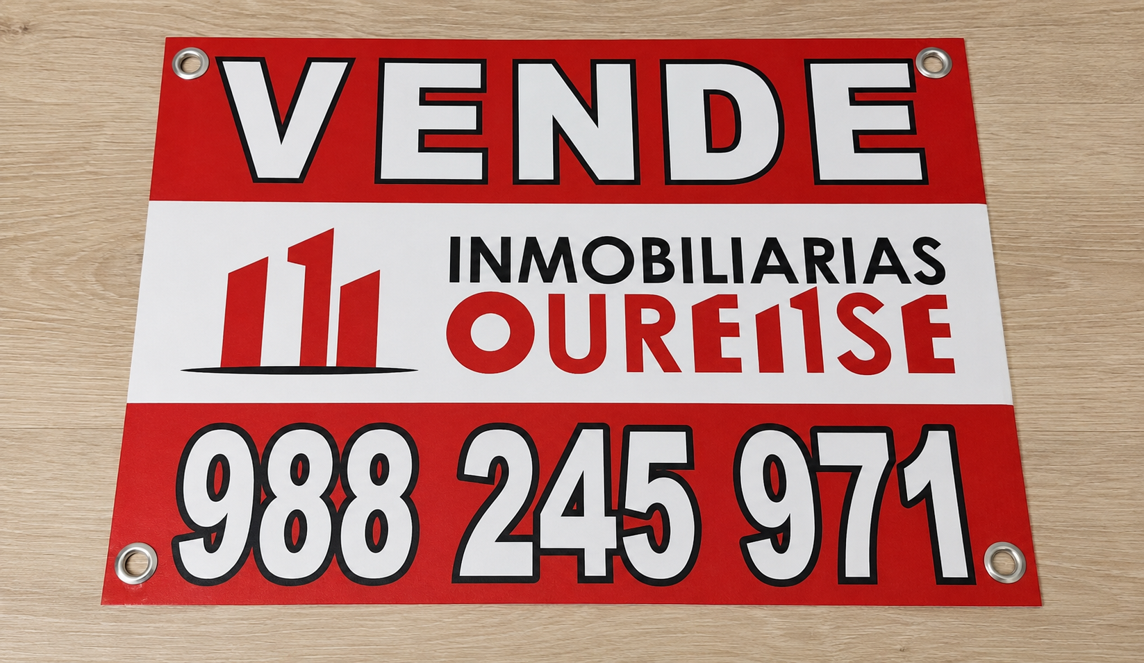 artel inmobiliario de venta Ourense Cartel inmobiliario rojo y blanco de venta para Inmobiliarias Oure1se, con ojales metálicos y datos de contacto.